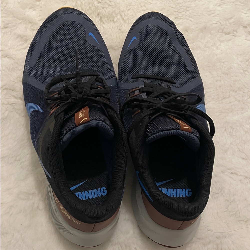 Nike Men's Athletic Shoes - Navy, Black, and Brown.